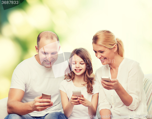 Image of happy family with smartphones