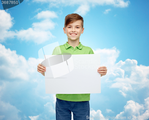 Image of happy boy in t-shirt holding white blank board