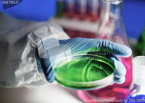 Image of close up of scientist making test in laboratory