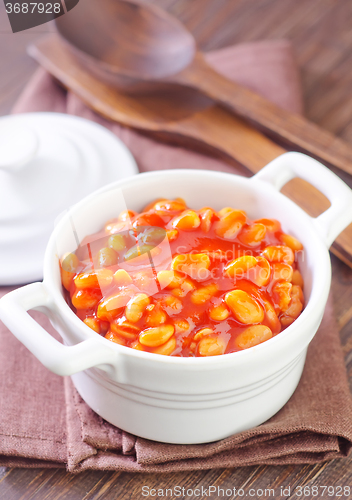 Image of white beans with tomato sauce