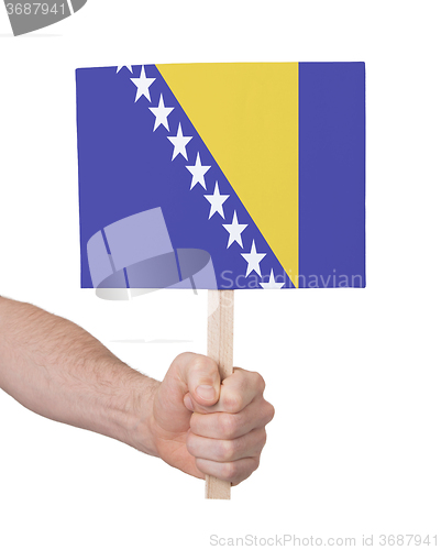 Image of Hand holding small card - Flag of Bosnia Herzegovina