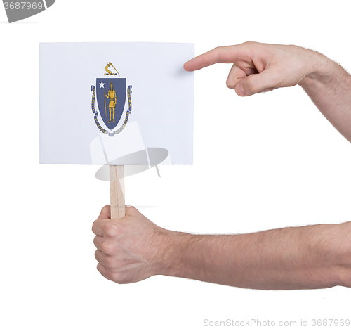 Image of Hand holding small card - Flag of Massachusetts