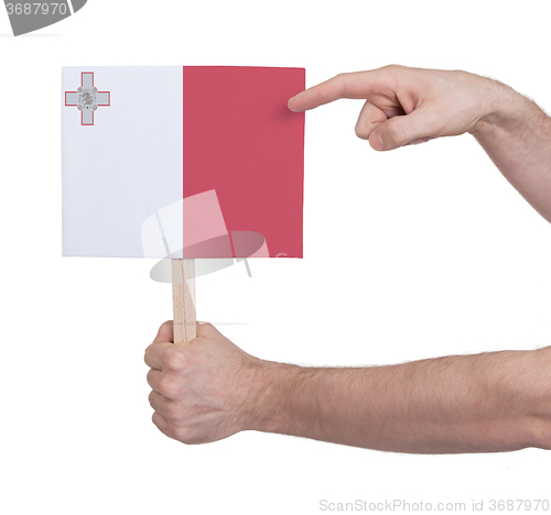 Image of Hand holding small card - Flag of Malta