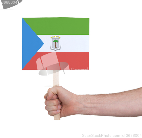 Image of Hand holding small card - Flag of Equatorial Guinea