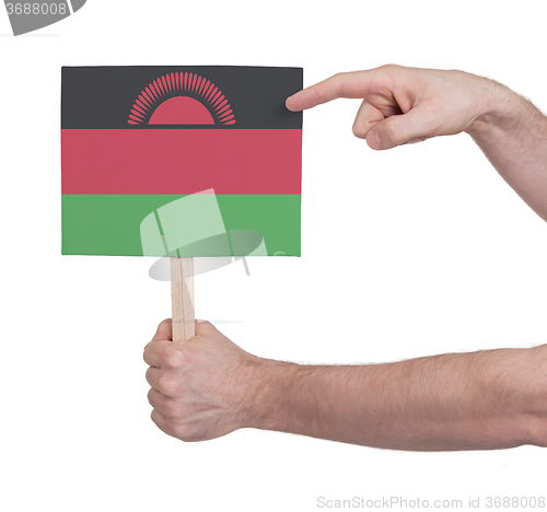 Image of Hand holding small card - Flag of Malawi