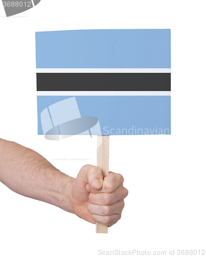 Image of Hand holding small card - Flag of Botswana