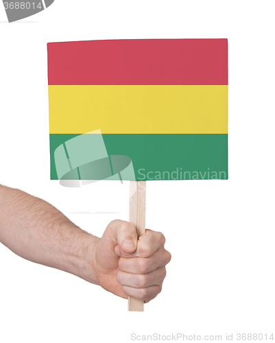 Image of Hand holding small card - Flag of Bolivia
