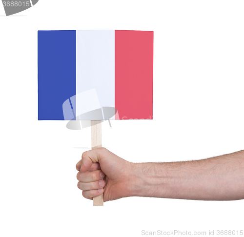 Image of Hand holding small card - Flag of France