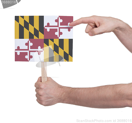 Image of Hand holding small card - Flag of Maryland