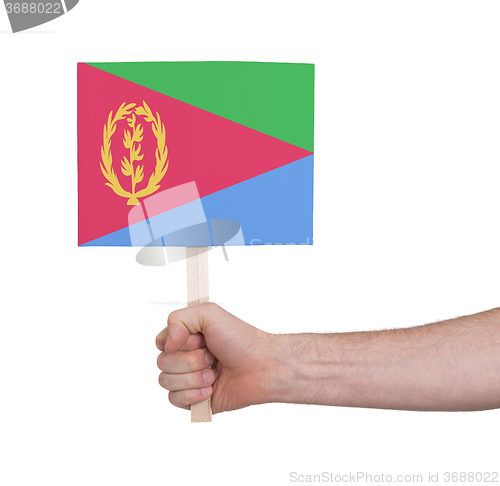 Image of Hand holding small card - Flag of Eritrea