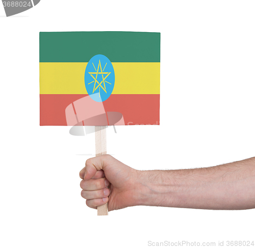 Image of Hand holding small card - Flag of Ethiopia