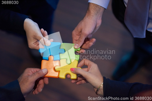 Image of assembling jigsaw puzzle