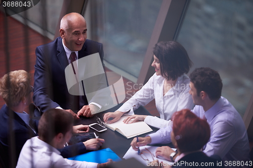 Image of business people group on meeting at modern bright office