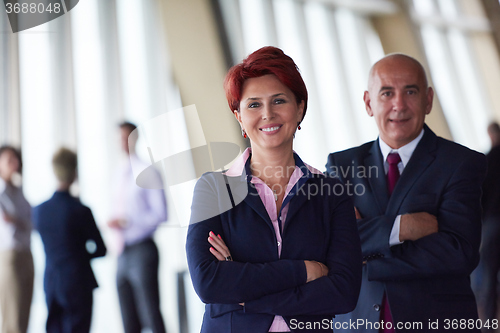 Image of diverse business people group with redhair  woman in front