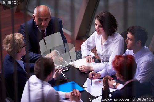 Image of business people group on meeting at modern bright office