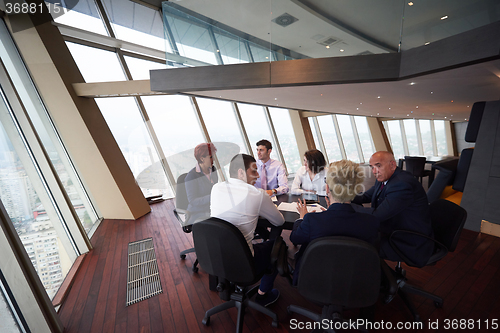 Image of business people group on meeting at modern bright office