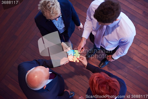 Image of assembling jigsaw puzzle