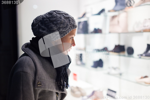 Image of Woman window shopping.