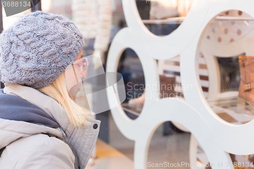 Image of Woman window shopping.