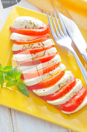 Image of caprese, fresh salad with tomato and mozzarella