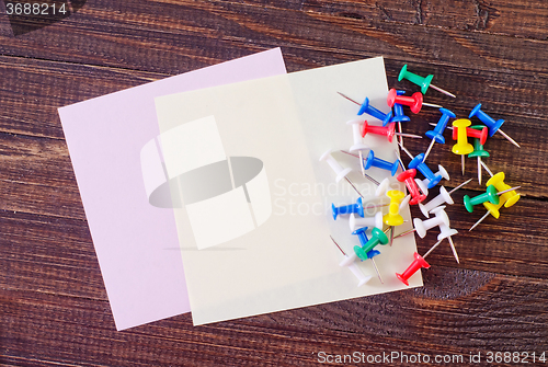 Image of color paper on wooden background