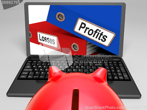 Image of Profits And Looses Files On Laptop Shows Expenses