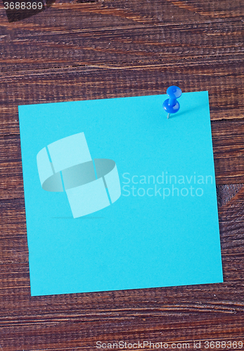 Image of color paper on wooden background