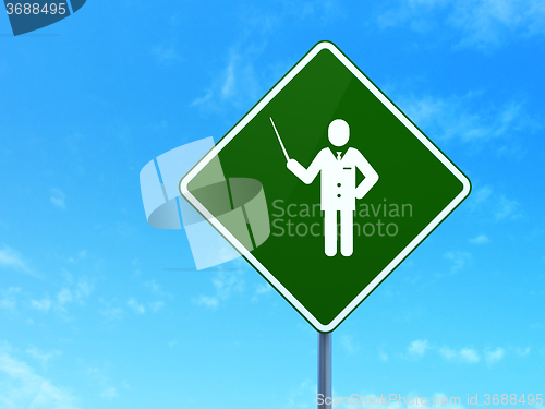 Image of Studying concept: Teacher on road sign background