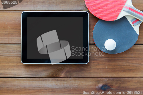 Image of close up of table tennis rackets and tablet pc