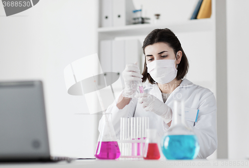 Image of close up of scientist making test in lab