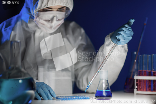 Image of close up of scientist making test in lab