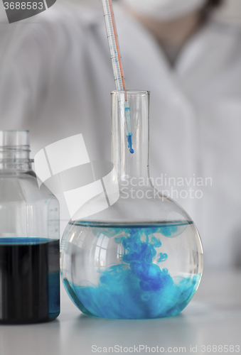 Image of close up of scientist making test in lab