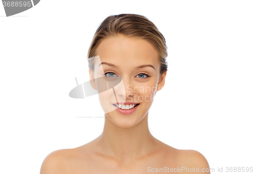 Image of smiling young woman face and shoulders
