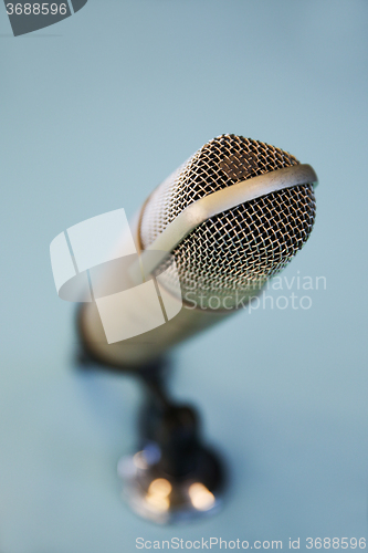 Image of close up of microphone at recording studio 