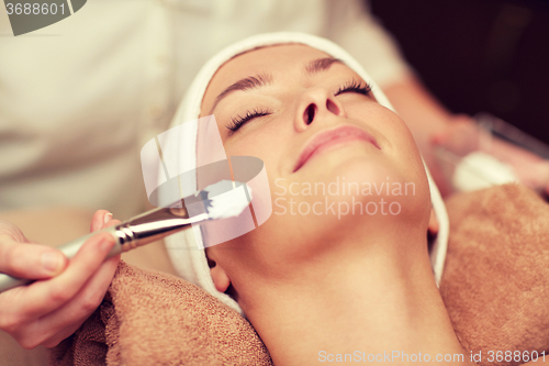 Image of close up of young woman and cosmetologist in spa