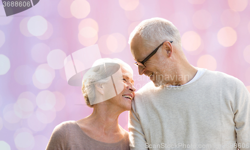 Image of happy senior couple looking at each other