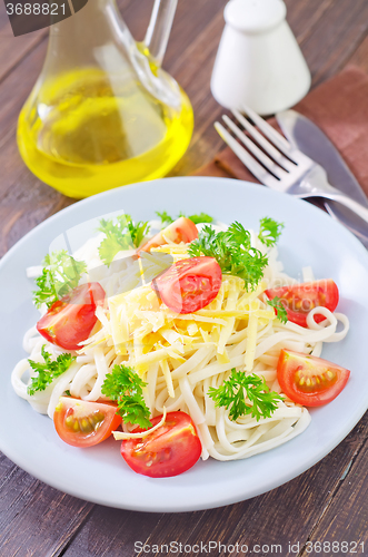 Image of pasta with cheese and tomato