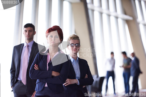 Image of diverse business people group with redhair  woman in front