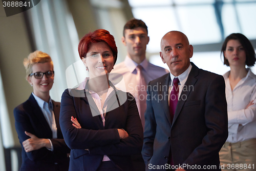 Image of diverse business people group with redhair  woman in front