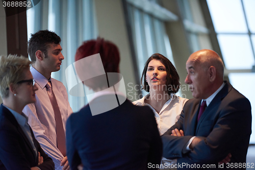 Image of business people group on meeting at modern bright office