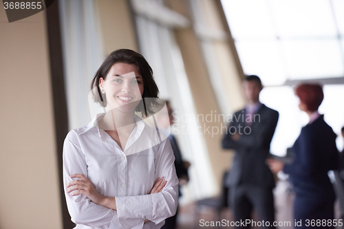 Image of business people group, woman in front  as team leader