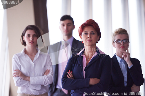 Image of diverse business people group with redhair  woman in front