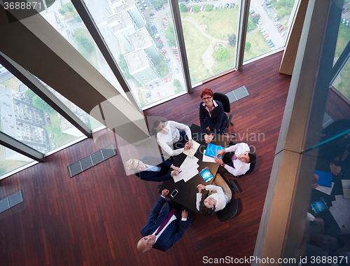 Image of top view of business people group throwing dociments in air