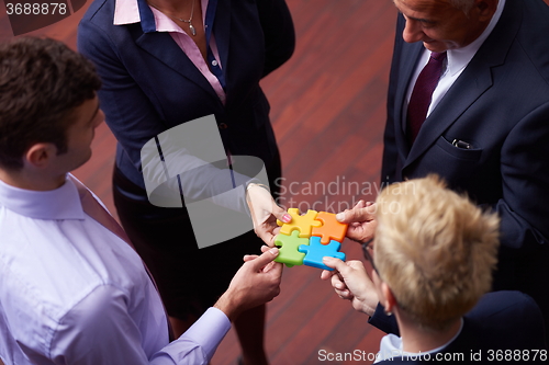 Image of assembling jigsaw puzzle