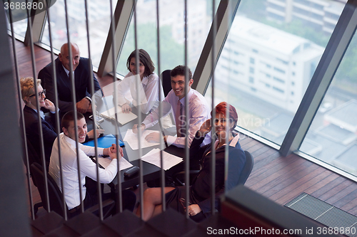 Image of business people group on meeting at modern bright office