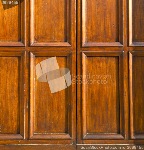 Image of  in mozzate rusty door curch  closed metal wood italy     milan