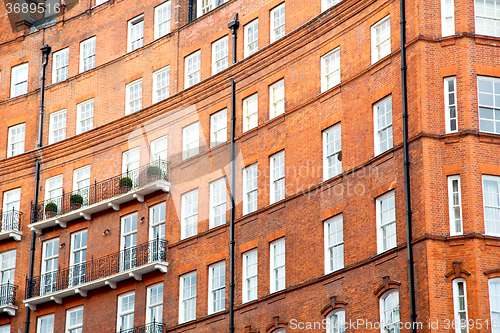 Image of window in  red brick wall and      historical 