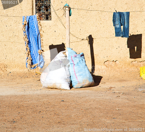 Image of bags  roof  moroccan old wall and brick in antique city