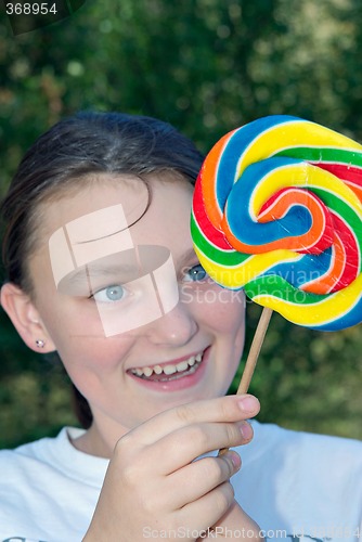 Image of teenager with lollipop