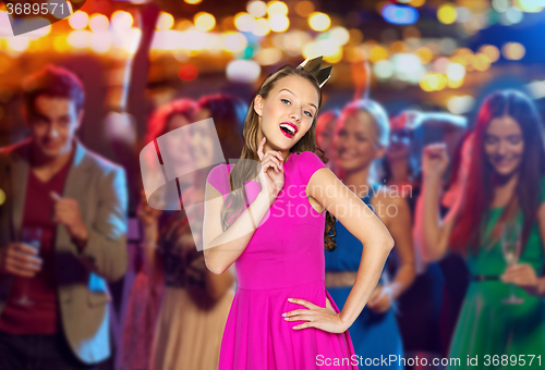 Image of happy young woman or teen girl in pink dress